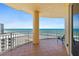 Enjoy ocean views from this spacious balcony with tiled floor and metal railing, perfect for relaxation at 2515 S Atlantic Ave # 1001, Daytona Beach Shores, FL 32118