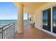 Private balcony overlooking the ocean featuring tile flooring, metal railing, and tranquil seating area at 2515 S Atlantic Ave # 1001, Daytona Beach Shores, FL 32118