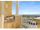 Outdoor grill on the balcony with views of the bay and surrounding cityscape, enhancing outdoor living at 2515 S Atlantic Ave # 1001, Daytona Beach Shores, FL 32118