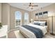 Bright bedroom features a ceiling fan, and large windows with views at 2515 S Atlantic Ave # 1001, Daytona Beach Shores, FL 32118