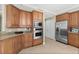 Spacious kitchen with modern stainless steel appliances and custom wood cabinetry at 2515 S Atlantic Ave # 1001, Daytona Beach Shores, FL 32118