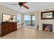 Inviting living room boasts a fireplace, media cabinet, and breathtaking ocean views through sliding glass doors at 2515 S Atlantic Ave # 1001, Daytona Beach Shores, FL 32118
