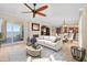 Open-concept living area with a fireplace, balcony access, and seamless flow into dining and kitchen spaces at 2515 S Atlantic Ave # 1001, Daytona Beach Shores, FL 32118