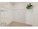 Spacious walk-in closet featuring wire shelving and carpeted floor provides ample storage at 2515 S Atlantic Ave # 1001, Daytona Beach Shores, FL 32118