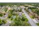 Wide aerial shot of a residential area with a pool and an adjacent road at 2551 Cross Country Dr, Port Orange, FL 32128