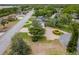 Aerial shot shows landscaped yard with decorative tree and a roundabout driveway at 2551 Cross Country Dr, Port Orange, FL 32128