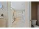 Bright bathroom with white cabinets, dual vanities, shower and toilet room at 2551 Cross Country Dr, Port Orange, FL 32128