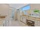 Bathroom features white cabinets, granite counters, tile flooring and glass shower at 2551 Cross Country Dr, Port Orange, FL 32128