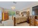 Spacious bedroom with wooden furniture, carpet flooring and natural light at 2551 Cross Country Dr, Port Orange, FL 32128