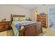 Comfortable bedroom features a beautiful furniture set and doorway leading into the ensuite bathroom at 2551 Cross Country Dr, Port Orange, FL 32128