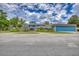 Charming multi-story home featuring a large garage, manicured lawn, and picturesque landscaping at 2551 Cross Country Dr, Port Orange, FL 32128