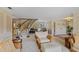 Elegant living room showcases a staircase, a piano, and tasteful decor for a cozy atmosphere at 2551 Cross Country Dr, Port Orange, FL 32128