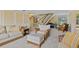 Comfortable living room offers a staircase, grand piano, and plush seating perfect for relaxation and entertaining at 2551 Cross Country Dr, Port Orange, FL 32128