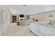 Spacious main bedroom with a fireplace, custom built-ins, a sitting area, and plenty of natural light at 2551 Cross Country Dr, Port Orange, FL 32128