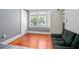 A bedroom featuring hardwood floors, a sofa, and ample natural light at 257 Huntington Dr, Deland, FL 32724