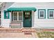 Charming home exterior showcasing a quaint front door and brick paver entry at 257 Huntington Dr, Deland, FL 32724