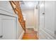 Hallway featuring wooden staircase and classic built-in storage at 257 Huntington Dr, Deland, FL 32724
