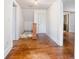 Hallway with wood flooring offering access to multiple rooms at 257 Huntington Dr, Deland, FL 32724