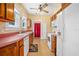 Traditional-style kitchen featuring wood cabinets, laminate countertops, and modern appliances at 257 Huntington Dr, Deland, FL 32724