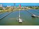 Fantastic aerial view showcasing a waterfront property with a private pier and boat dock, ideal for boating enthusiasts at 2636 S Peninsula Dr, Daytona Beach, FL 32118