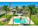 Gorgeous backyard with a sparkling pool, framed by lush greenery and palm trees, offering a private oasis at 2636 S Peninsula Dr, Daytona Beach, FL 32118