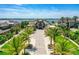 Stunning aerial view of a luxurious estate with lush landscaping, a waterfront view, and a long private driveway at 2636 S Peninsula Dr, Daytona Beach, FL 32118