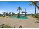 Beautiful outdoor space featuring a private pool, mature palm trees, and a serene waterfront view, perfect for relaxation at 2636 S Peninsula Dr, Daytona Beach, FL 32118