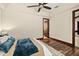 Bedroom boasts tray ceilings, hardwood floors, and ceiling fan at 2636 S Peninsula Dr, Daytona Beach, FL 32118