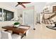 Dining area next to great room with a glass block wall and staircase in view at 2636 S Peninsula Dr, Daytona Beach, FL 32118