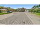 Beautiful home featuring a patterned brick driveway, lush landscaping, and ample parking at 2636 S Peninsula Dr, Daytona Beach, FL 32118