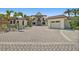 Elegant home featuring a three-car garage, manicured landscaping, and a spacious driveway, blending luxury and comfort at 2636 S Peninsula Dr, Daytona Beach, FL 32118