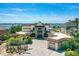 Waterfront home boasting a barrel tile roof, paver driveway, meticulous landscaping, and stunning water views at 2636 S Peninsula Dr, Daytona Beach, FL 32118