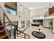 Grand foyer showcasing chandelier, high ceilings, staircase, open layout with access to the kitchen at 2636 S Peninsula Dr, Daytona Beach, FL 32118