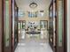 Grand foyer with tile flooring, soaring ceilings, a decorative rug, and views of the backyard at 2636 S Peninsula Dr, Daytona Beach, FL 32118