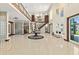 Spacious foyer featuring soaring ceilings, tile flooring, grand staircase, and an open layout at 2636 S Peninsula Dr, Daytona Beach, FL 32118