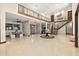 Spacious open concept foyer with tile floors, high ceilings, staircase, and seamless flow to other living spaces at 2636 S Peninsula Dr, Daytona Beach, FL 32118