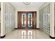 Stunning foyer with tile flooring, glass block accents, and an impressive front door at 2636 S Peninsula Dr, Daytona Beach, FL 32118