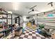 Spacious garage with checkerboard floor, ample storage, and room for multiple vehicles at 2636 S Peninsula Dr, Daytona Beach, FL 32118