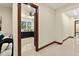 Hallway featuring a glimpse of a modern kitchen with dark cabinetry and light walls at 2636 S Peninsula Dr, Daytona Beach, FL 32118