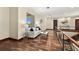 Bright hallway with hardwood floors, neutral walls, and modern metal railing, showcasing a clean and stylish design at 2636 S Peninsula Dr, Daytona Beach, FL 32118