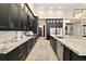 Spacious kitchen boasts granite countertops, custom cabinets, and stainless steel appliances at 2636 S Peninsula Dr, Daytona Beach, FL 32118