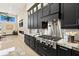 Gourmet kitchen features a gas cooktop, custom cabinets, and granite countertops at 2636 S Peninsula Dr, Daytona Beach, FL 32118