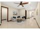 Inviting living room with a corner sofa, ceiling fan, and a soothing color palette, perfect for relaxation at 2636 S Peninsula Dr, Daytona Beach, FL 32118