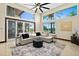 Inviting living room with ample natural light, plush seating, and views of lush landscaping at 2636 S Peninsula Dr, Daytona Beach, FL 32118