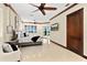 Spacious main bedroom with ceiling fan, water view and a private balcony, offering a tranquil retreat at 2636 S Peninsula Dr, Daytona Beach, FL 32118