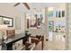 Upstairs office area looking out onto a great room with stairwell access to the second story at 2636 S Peninsula Dr, Daytona Beach, FL 32118