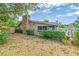 Enjoy the peaceful privacy offered in this shady backyard space with a stone chimney at 2704 Burgoyne Pl, Deland, FL 32720