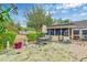 This backyard has an expansive patio, seating and a screened-in porch at 2704 Burgoyne Pl, Deland, FL 32720