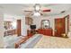 Spacious bedroom featuring ceiling fan, dresser, and an ensuite bathroom at 2704 Burgoyne Pl, Deland, FL 32720