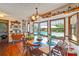 Bright dining room with views of the backyard pool through large windows at 2704 Burgoyne Pl, Deland, FL 32720